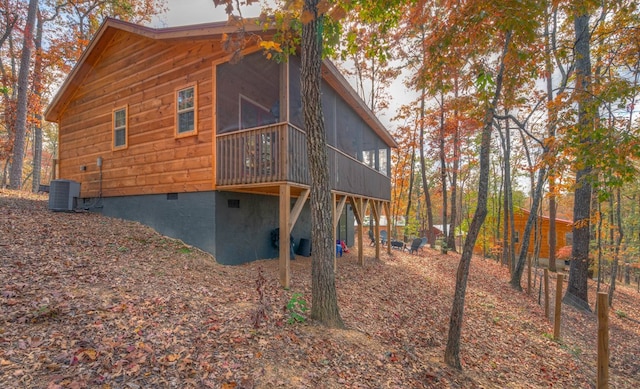 back of house with a sunroom and cooling unit