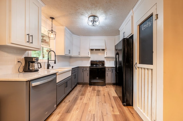 365 Quarles Ln, Ellijay, GA 30540 - kitchen with black appliances, gray cabinetry, light wood-style flooring, light countertops, and a textured ceiling