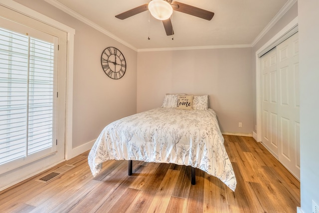 365 Quarles Ln, Ellijay, GA 30540 - bedroom featuring wood finished floors, ornamental molding, a closet, and a ceiling fan