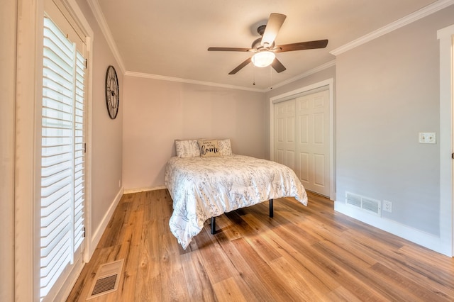 365 Quarles Ln, Ellijay, GA 30540 - bedroom with a closet, wood finished floors, crown molding, and ceiling fan