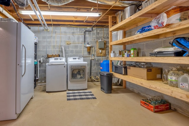 365 Quarles Ln, Ellijay, GA 30540 - unfinished basement with freestanding refrigerator, washing machine and dryer, and a water pressure tank