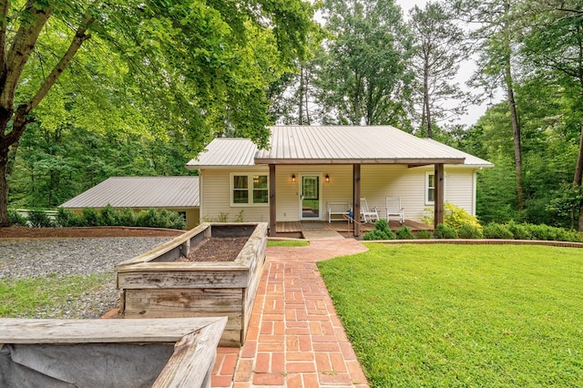365 Quarles Ln, Ellijay, GA 30540 - view of front of house with a front yard, a metal roof, and covered porch