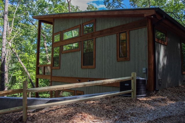 view of side of home featuring cooling unit