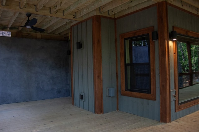 exterior space with hardwood / wood-style flooring, vaulted ceiling, and ceiling fan