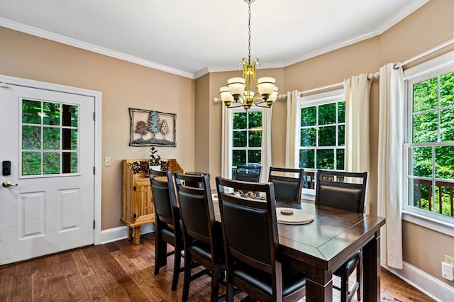 615 Navaho Way, Ellijay, GA 30540 - dining space featuring a chandelier, dark wood-style flooring, baseboards, and crown molding