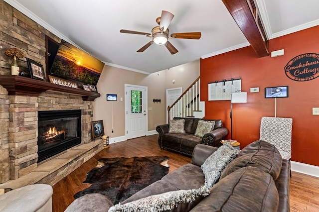 615 Navaho Way, Ellijay, GA 30540 - living room featuring ceiling fan, wood finished floors, a fireplace, stairway, and ornamental molding