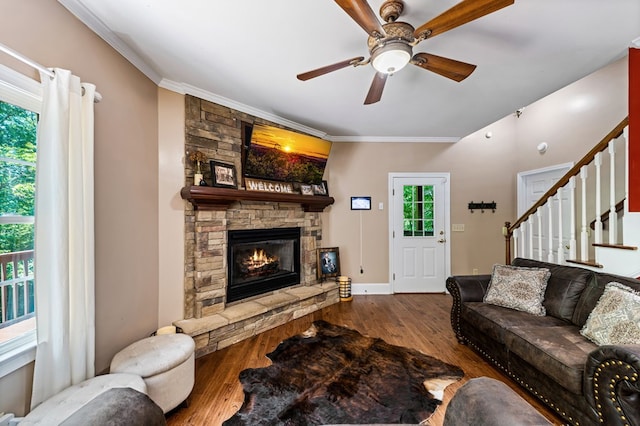 615 Navaho Way, Ellijay, GA 30540 - living area with a stone fireplace, wood finished floors, a ceiling fan, stairs, and ornamental molding