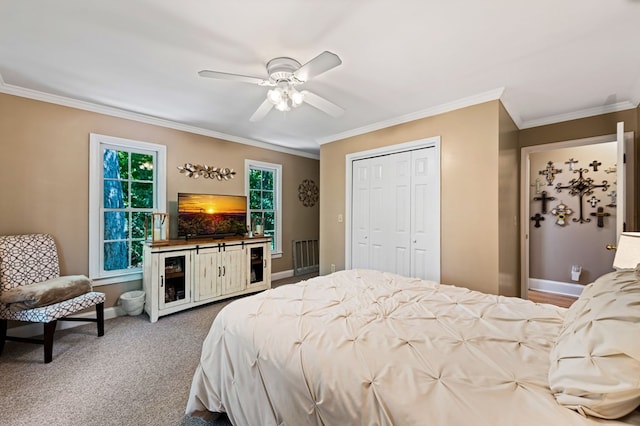 615 Navaho Way, Ellijay, GA 30540 - bedroom with baseboards, crown molding, a closet, a ceiling fan, and carpet floors