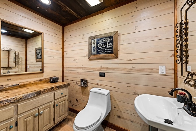 615 Navaho Way, Ellijay, GA 30540 - bathroom with wood walls, a sink, wooden ceiling, wood finished floors, and toilet
