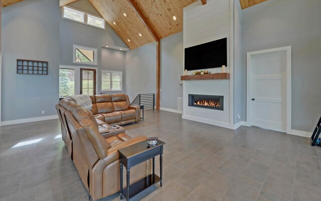 433 Hawkeye Trl, Marble, NC 28905 - living area with wooden ceiling, beamed ceiling, a large fireplace, baseboards, and high vaulted ceiling