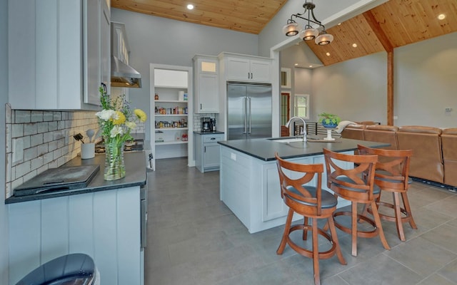 433 Hawkeye Trl, Marble, NC 28905 - kitchen with range hood, a sink, built in refrigerator, wood ceiling, and dark countertops