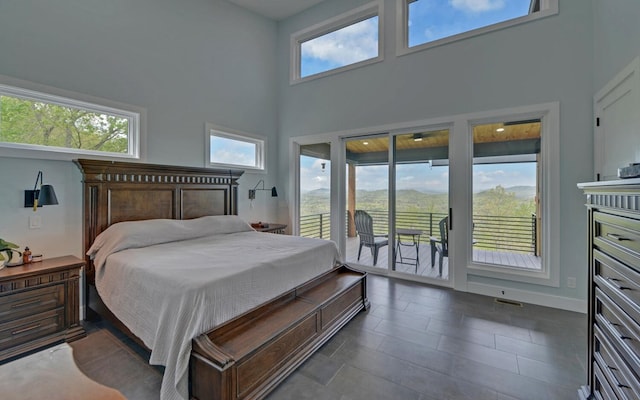 433 Hawkeye Trl, Marble, NC 28905 - bedroom featuring multiple windows, visible vents, access to outside, and a high ceiling