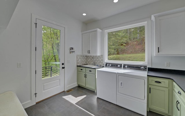 433 Hawkeye Trl, Marble, NC 28905 - clothes washing area featuring recessed lighting, dark tile patterned flooring, washer and dryer, cabinet space, and baseboards