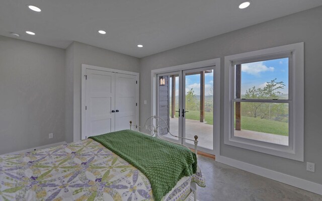 433 Hawkeye Trl, Marble, NC 28905 - bedroom with finished concrete flooring, baseboards, recessed lighting, french doors, and access to outside