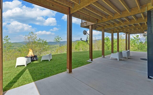 433 Hawkeye Trl, Marble, NC 28905 - view of patio featuring a fire pit and a mountain view