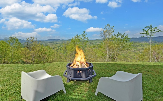 433 Hawkeye Trl, Marble, NC 28905 - view of yard featuring a mountain view, a fire pit, and a wooded view