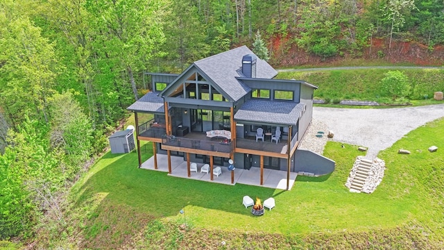 433 Hawkeye Trl, Marble, NC 28905 - back of property featuring a patio, a wooden deck, a shed, an outbuilding, and a lawn