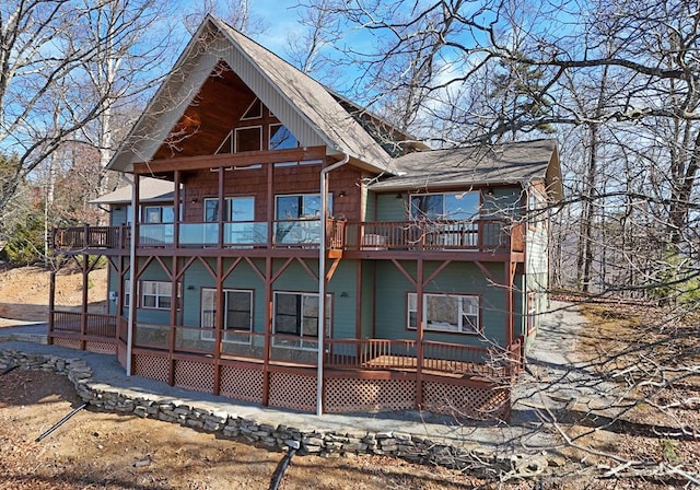 back of property with a balcony