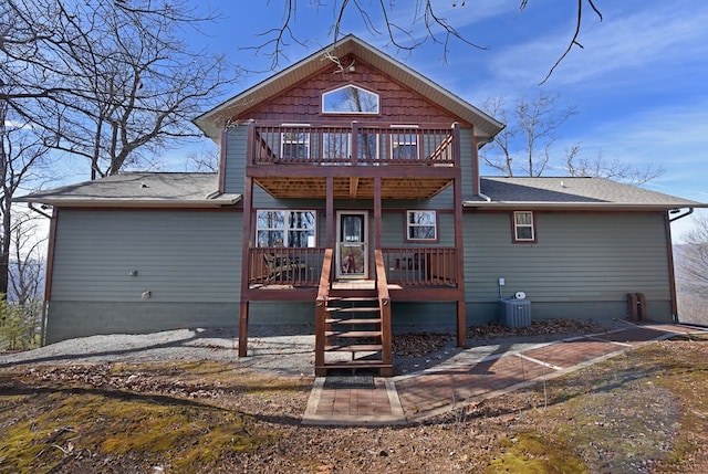 rear view of property featuring central AC unit