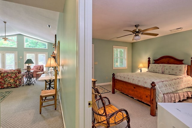 bedroom with light carpet, vaulted ceiling, and ceiling fan