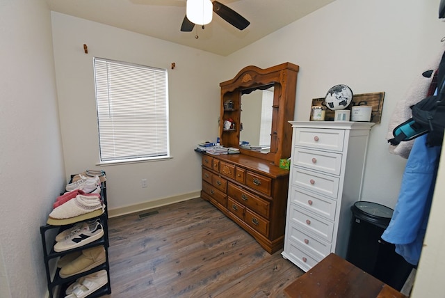 misc room featuring ceiling fan and dark hardwood / wood-style floors