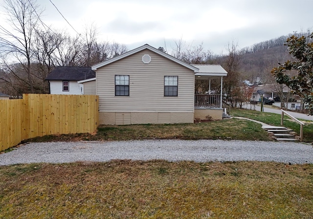 view of property exterior with a lawn