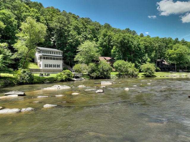 surrounding community featuring a water view