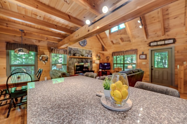 56 Laurel Dr, Blue Ridge, GA 30513 - dining space with wood finished floors, wood walls, wood ceiling, and a stone fireplace