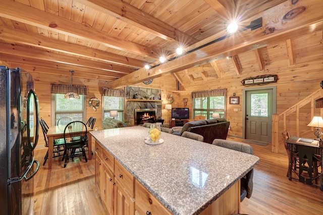56 Laurel Dr, Blue Ridge, GA 30513 - kitchen featuring freestanding refrigerator, wooden walls, light wood-style flooring, healthy amount of natural light, and wood ceiling