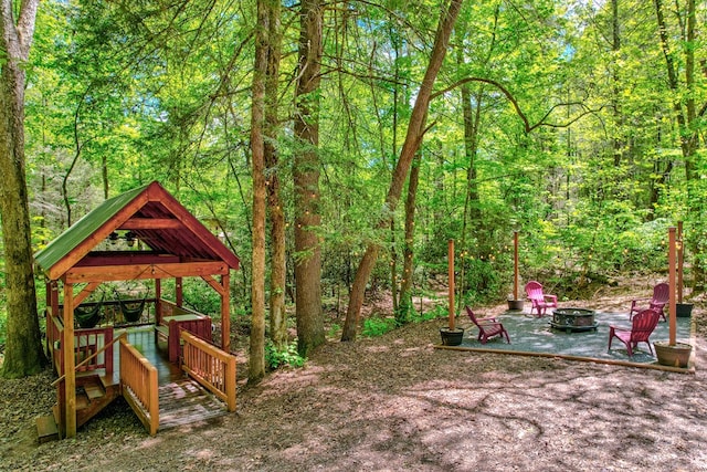 56 Laurel Dr, Blue Ridge, GA 30513 - view of yard featuring a fire pit, a gazebo, a patio area, and a view of trees
