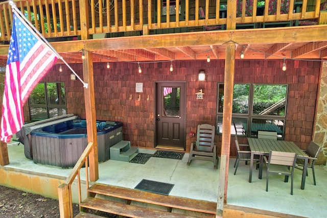 56 Laurel Dr, Blue Ridge, GA 30513 - view of patio / terrace featuring a hot tub and outdoor dining area