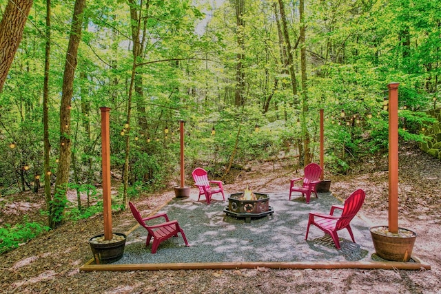 56 Laurel Dr, Blue Ridge, GA 30513 - view of yard with a fire pit, a view of trees, and a patio