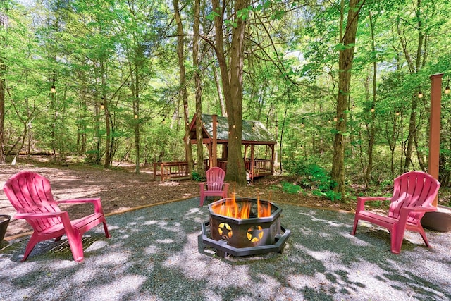 56 Laurel Dr, Blue Ridge, GA 30513 - view of playground featuring an outdoor fire pit and a view of trees