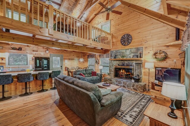 56 Laurel Dr, Blue Ridge, GA 30513 - living area with wood walls, high vaulted ceiling, wooden ceiling, a ceiling fan, and wood finished floors