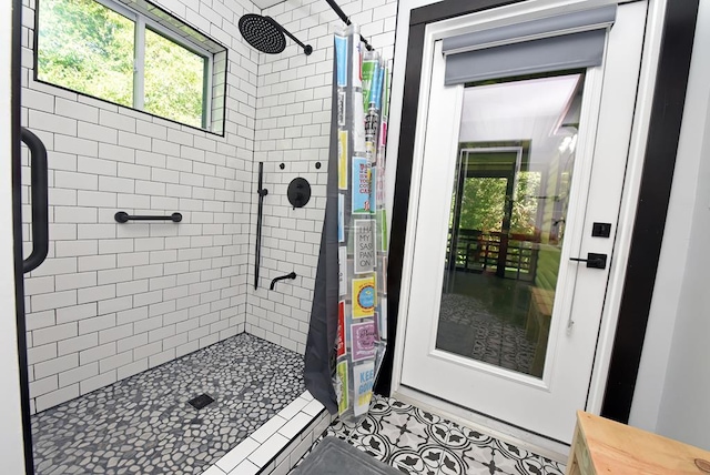 bathroom featuring tile patterned floors and curtained shower