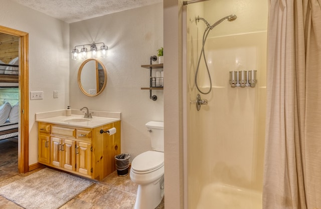 bathroom with a shower with curtain, toilet, a textured ceiling, and vanity