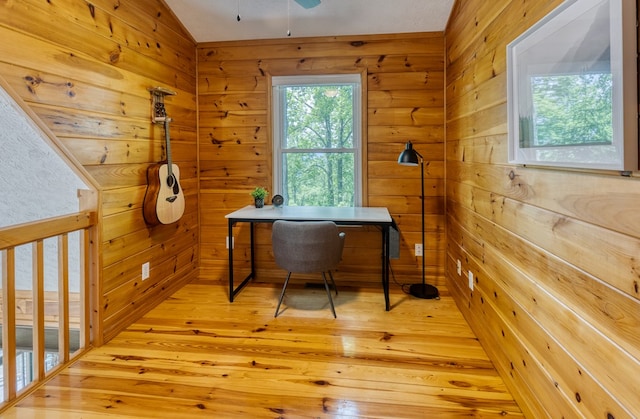 office with ceiling fan and light hardwood / wood-style flooring