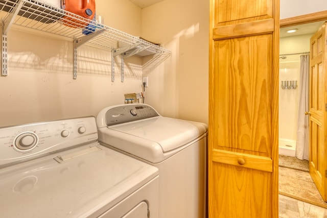 clothes washing area with independent washer and dryer