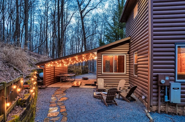 view of patio / terrace with an outdoor fire pit