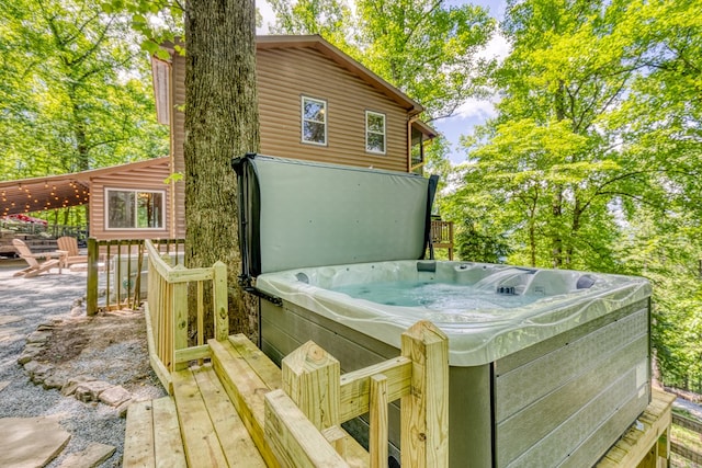 deck featuring a hot tub