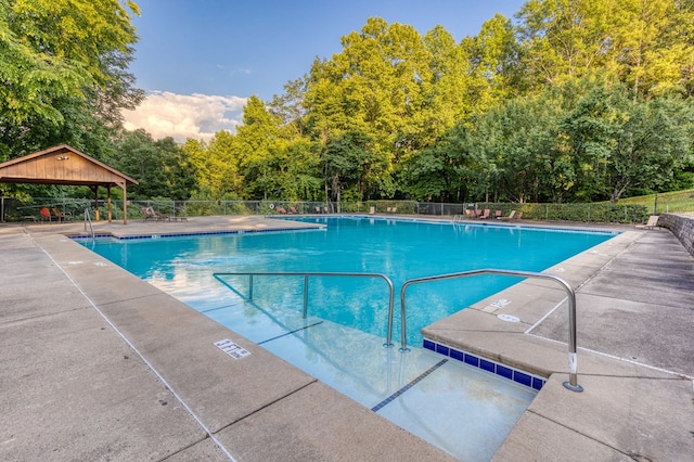 view of swimming pool featuring a gazebo and a patio area