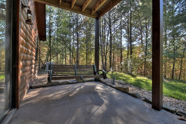view of patio featuring a wooded view