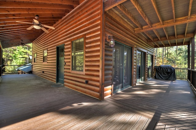 deck with a ceiling fan and area for grilling
