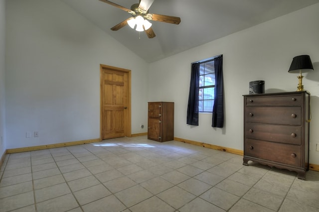 unfurnished bedroom featuring high vaulted ceiling, a ceiling fan, and baseboards