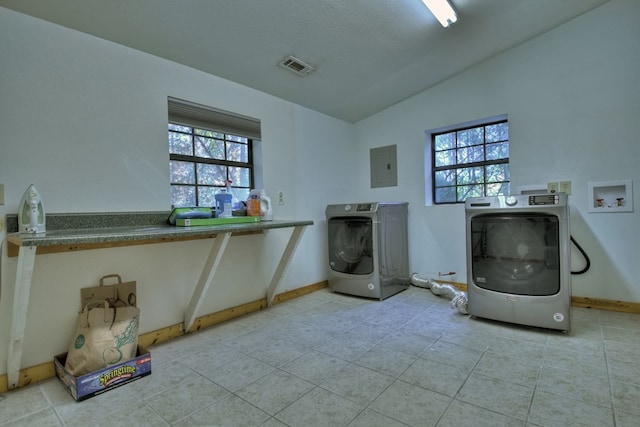 washroom with electric panel, visible vents, washer hookup, laundry area, and light tile patterned floors