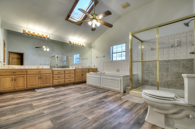 full bathroom with a bath, a shower stall, and ceiling fan