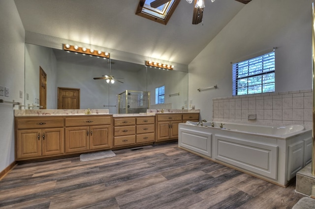 full bathroom with wood finished floors, high vaulted ceiling, and ceiling fan