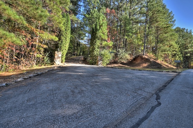 view of street featuring a wooded view