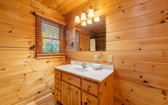 bathroom with wooden walls, vanity, wood ceiling, and walk in shower