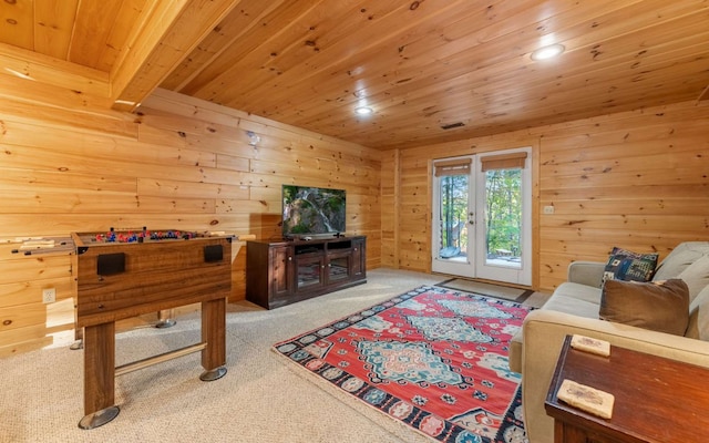 game room featuring carpet, french doors, wood ceiling, wooden walls, and beamed ceiling